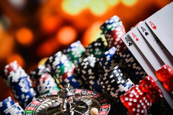 Mobile phone displaying UFC sportsbook markets alongside live blackjack table on lucky77 app